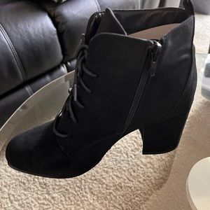 Black booties new never used zip and lace up.